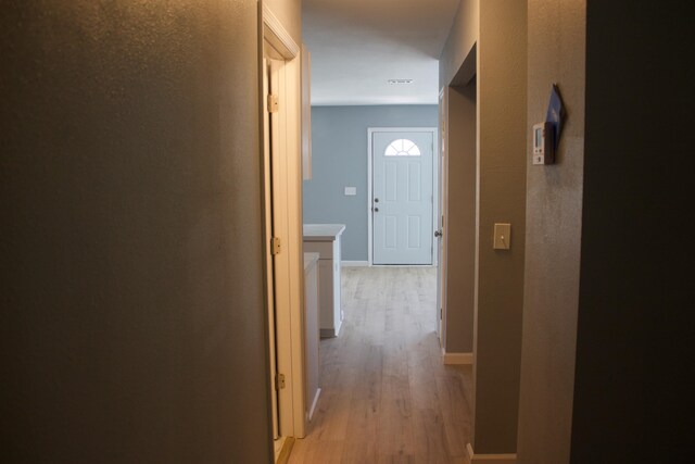 corridor featuring light wood-type flooring