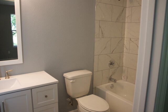 full bathroom featuring vanity, toilet, and tiled shower / bath combo