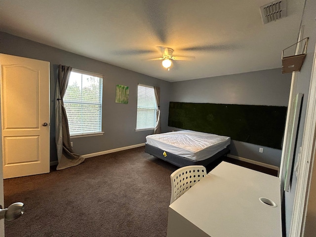 bedroom featuring ceiling fan and dark carpet