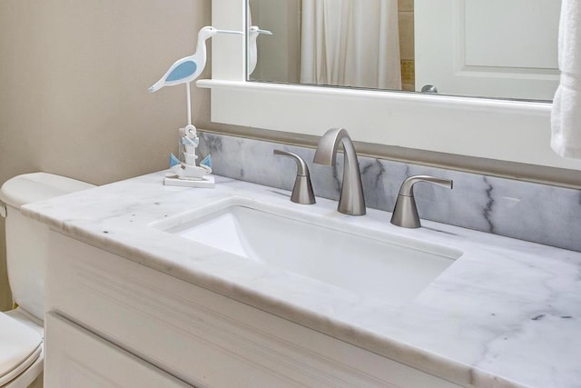 interior details with vanity and toilet