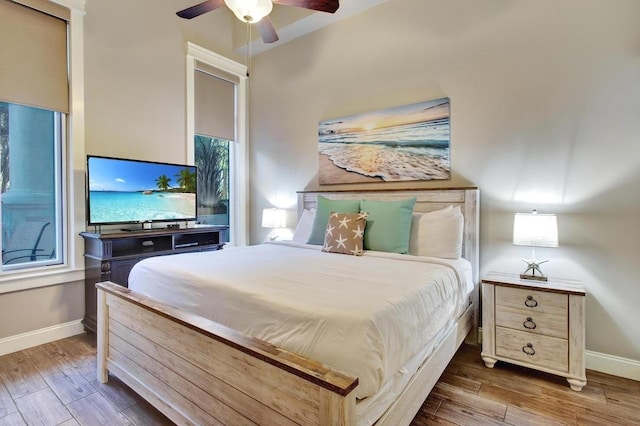 bedroom featuring hardwood / wood-style flooring and ceiling fan