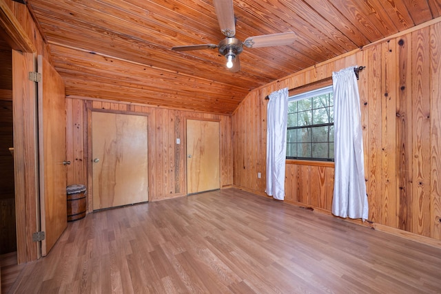 bonus room with wood walls, wood ceiling, and hardwood / wood-style flooring