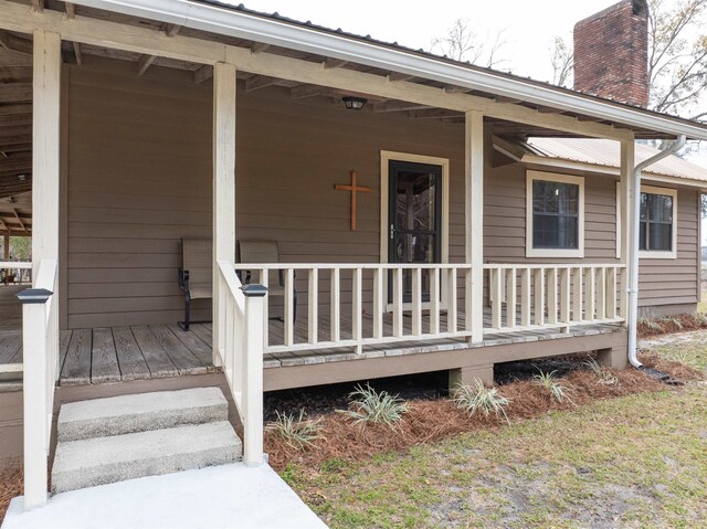 property entrance with covered porch