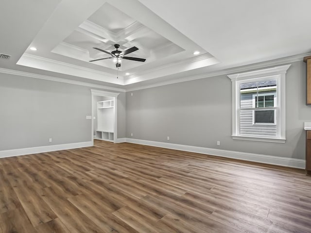 unfurnished room with crown molding, ceiling fan, wood-type flooring, and coffered ceiling