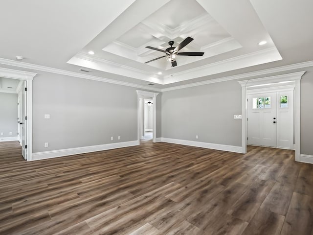 unfurnished living room featuring crown molding, dark wood-type flooring, ceiling fan, and a tray ceiling