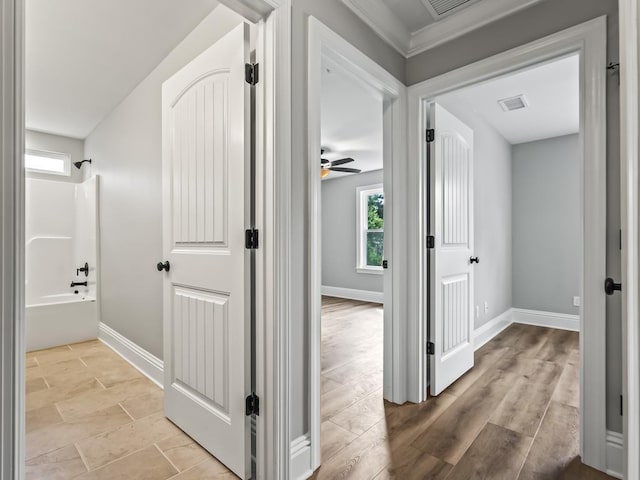 corridor with light hardwood / wood-style flooring