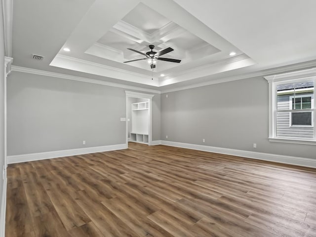 spare room featuring ceiling fan, ornamental molding, and wood-type flooring