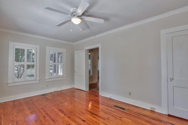 837 E Park Ave, Tallahassee, FL 32301 - empty room with hardwood / wood-style flooring, ceiling fan, and ornamental molding