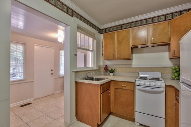 837 E Park Ave, Tallahassee, FL 32301 - kitchen with light tile patterned flooring, white appliances, crown molding, and sink