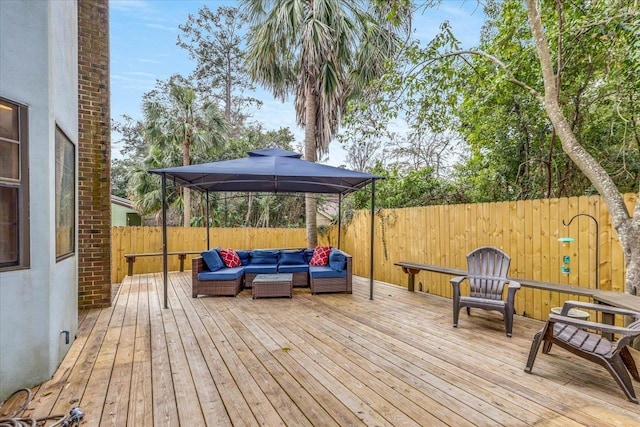 deck with an outdoor living space and a gazebo