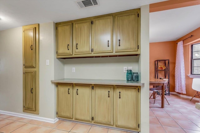 kitchen with light tile patterned floors