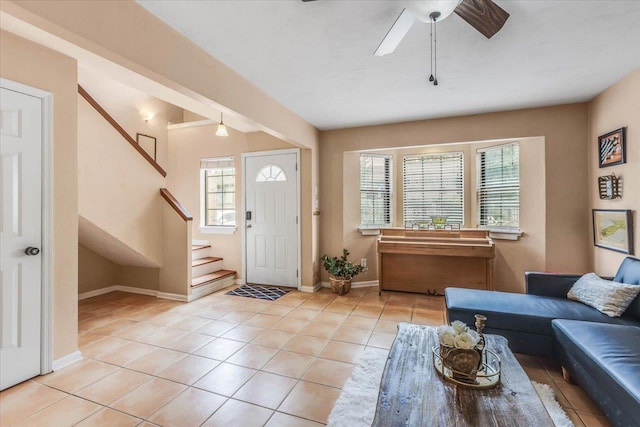 tiled entrance foyer with ceiling fan