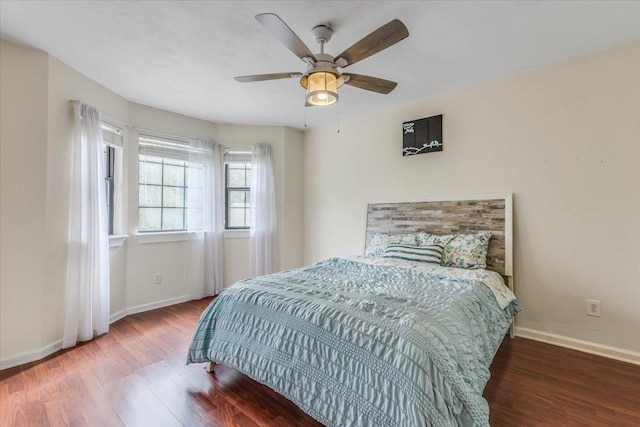 bedroom with hardwood / wood-style flooring and ceiling fan