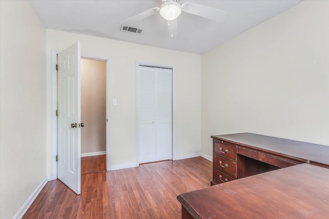 interior space featuring ceiling fan and dark hardwood / wood-style flooring