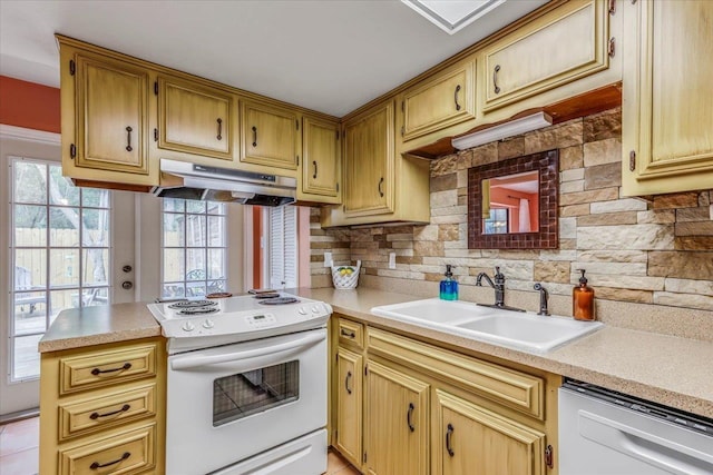 kitchen with sink, dishwashing machine, kitchen peninsula, white range with electric cooktop, and backsplash