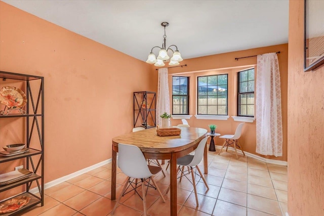 dining area featuring an inviting chandelier and light tile patterned floors