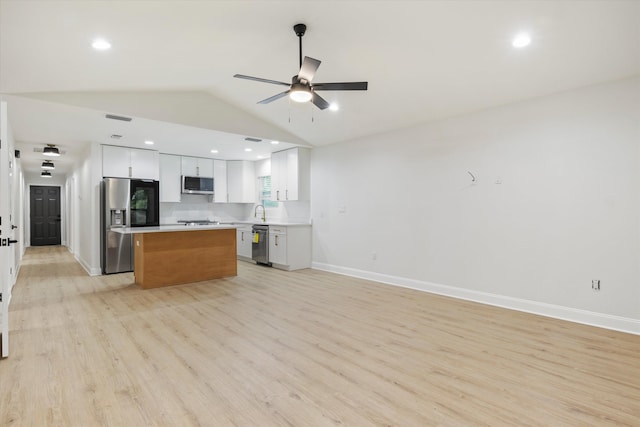 2224 Keith St, Tallahassee, FL 32310 - kitchen featuring stainless steel appliances, a ceiling fan, a center island, light wood-type flooring, and open floor plan