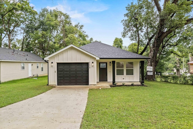 2224 Keith St, Tallahassee, FL 32310 - view of front facade with board and batten siding, an attached garage, roof with shingles, and driveway