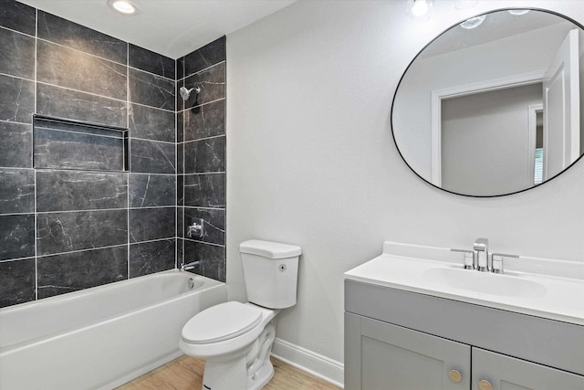 2224 Keith St, Tallahassee, FL 32310 - full bathroom with vanity, wood finished floors, and washtub / shower combination