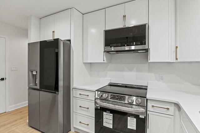 2224 Keith St, Tallahassee, FL 32310 - kitchen with appliances with stainless steel finishes and white cabinets