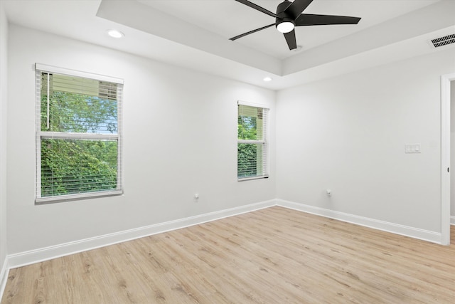 2224 Keith St, Tallahassee, FL 32310 - spare room featuring light wood finished floors, a ceiling fan, recessed lighting, and a raised ceiling