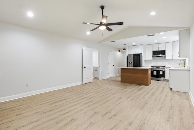 2224 Keith St, Tallahassee, FL 32310 - kitchen featuring appliances with stainless steel finishes, a center island, open floor plan, a ceiling fan, and light countertops