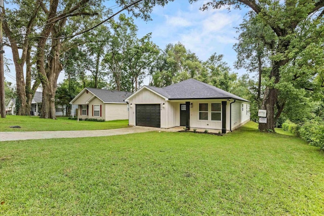 2224 Keith St, Tallahassee, FL 32310 - ranch-style house with driveway, a garage, a front yard, and roof with shingles