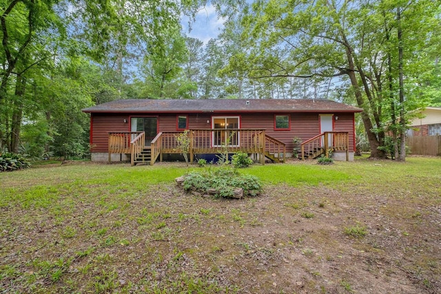 2104 Alton Rd, Tallahassee, FL 32303 - back of house featuring a wooden deck and a yard