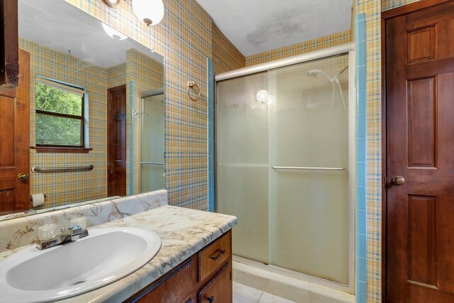 2104 Alton Rd, Tallahassee, FL 32303 - full bathroom featuring a stall shower, tile patterned floors, and vanity