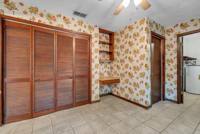 2104 Alton Rd, Tallahassee, FL 32303 - unfurnished dining area with wallpapered walls, water heater, ceiling fan, baseboards, and light tile patterned floors