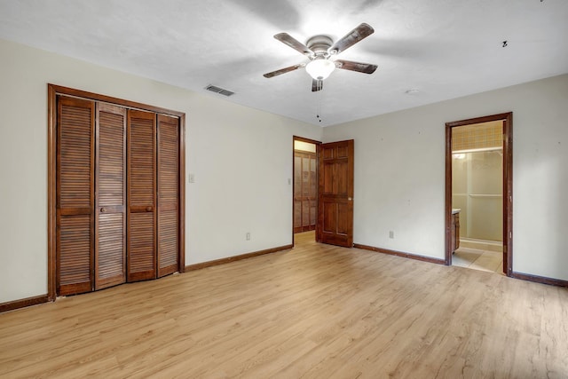 2104 Alton Rd, Tallahassee, FL 32303 - unfurnished bedroom with light wood finished floors, a closet, and baseboards
