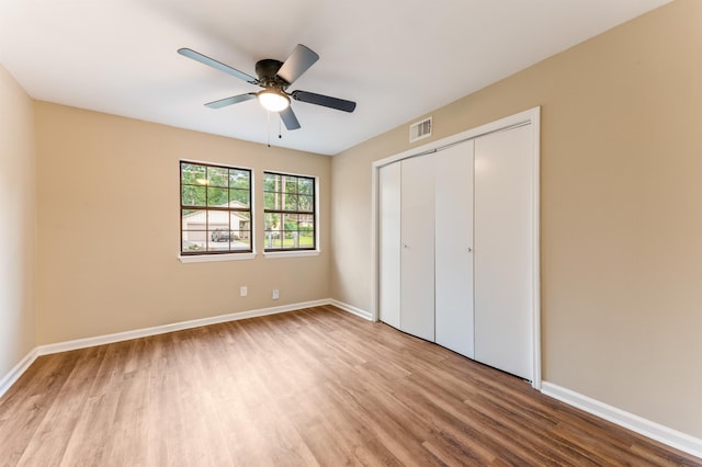 2053 Ted Hines Dr, Tallahassee, FL 32308 - unfurnished bedroom with wood finished floors, a closet, and a ceiling fan