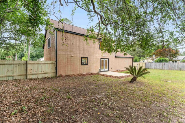 2053 Ted Hines Dr, Tallahassee, FL 32308 - back of property with french doors and a fenced backyard