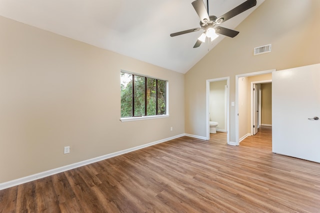 2053 Ted Hines Dr, Tallahassee, FL 32308 - unfurnished bedroom featuring high vaulted ceiling, wood finished floors, ensuite bathroom, and a ceiling fan