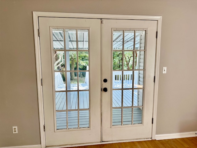 doorway to outside featuring light wood-type flooring and french doors