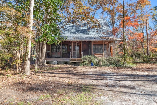 view of front of property with a sunroom