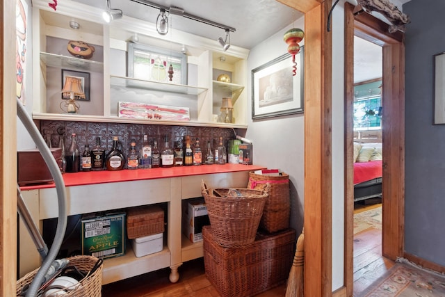 bar with wood-type flooring