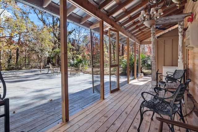 wooden deck featuring ceiling fan