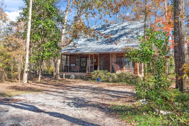 view of front of house featuring a sunroom