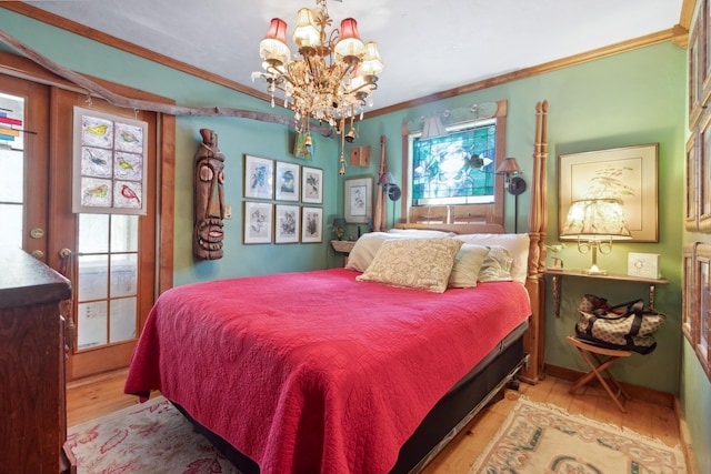 bedroom featuring ornamental molding, light hardwood / wood-style floors, and a notable chandelier