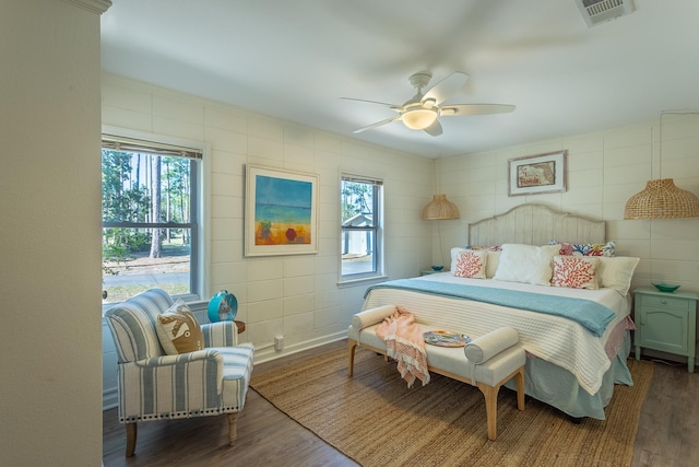 bedroom with hardwood / wood-style flooring and ceiling fan