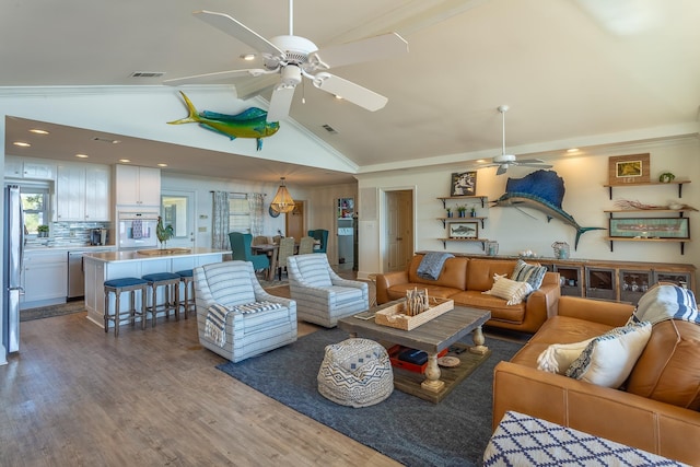 living room featuring hardwood / wood-style flooring, high vaulted ceiling, and ceiling fan