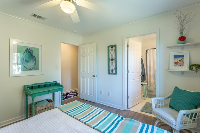 bedroom with ornamental molding, hardwood / wood-style floors, and ceiling fan