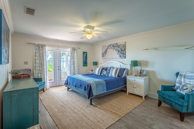 bedroom featuring hardwood / wood-style flooring, ornamental molding, access to exterior, ceiling fan, and french doors