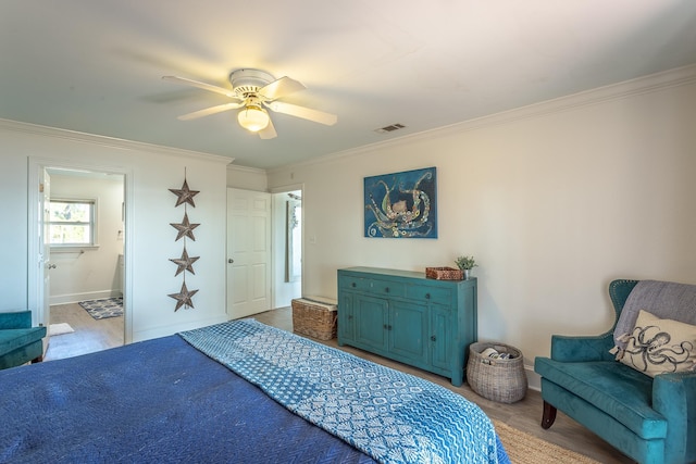 bedroom featuring ornamental molding, ceiling fan, and light hardwood / wood-style floors