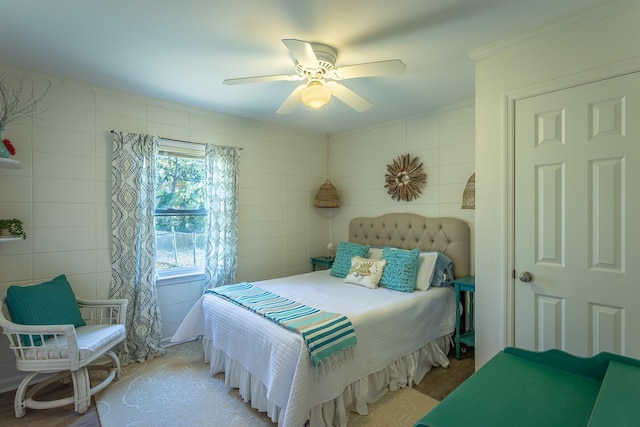 bedroom with crown molding and ceiling fan