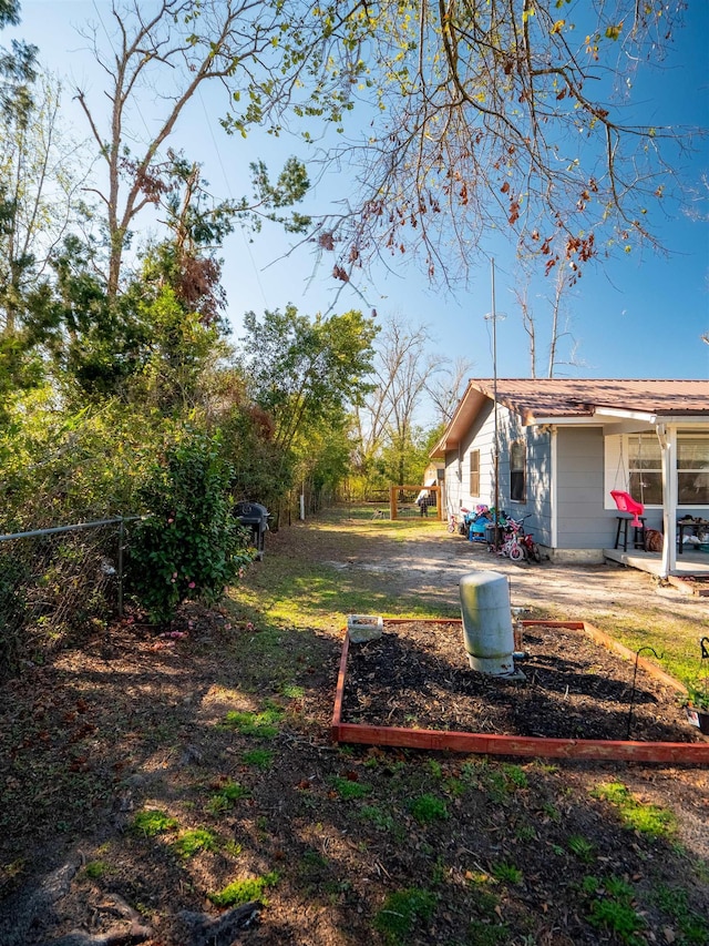 view of yard with a patio and fence