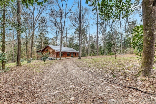 220 Deer Pass, Havana, FL 32333 - view of yard featuring gravel driveway and a wooded view