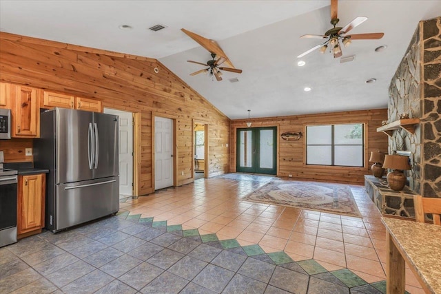 220 Deer Pass, Havana, FL 32333 - kitchen featuring visible vents, wood walls, open floor plan, a ceiling fan, and appliances with stainless steel finishes