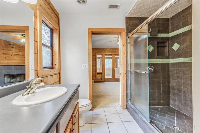 220 Deer Pass, Havana, FL 32333 - bathroom with visible vents, vanity, tile patterned floors, a ceiling fan, and a stall shower